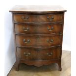 A reproduction George III style mahogany bowfront four drawer chest, 61cm wide, 47cm deep,