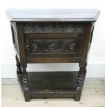 A reproduction 17th century style carved oak credence cupboard, 85cm wide x 41cm deep x 81cm high.