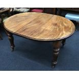 An early Victorian mahogany extending dining table,