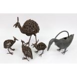 A set of three wrought metal figures of birds, 20th century, and another,