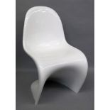 A contemporary Vitra white all plastic chair.