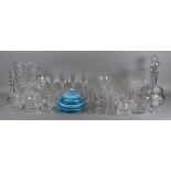 A large cut glass vase, spiral column candlestick, decanters,