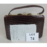 A vintage crocodile skin ladies handbag, with original bill of sale from Rowland Ward, Nairobi,