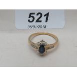 An 18ct yellow gold diamond and sapphire ring (size R) est: £250-£300