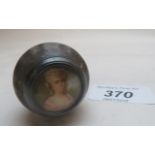 The top of a cane handle, with inset hand painted miniature of a lady in a pinkish dress,