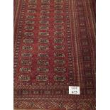 A 20th century Persian rug on terracotta field (175 x 128 cm approx) est: £50-£80