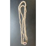 A graduated two row strand of pearls est: £50-£80