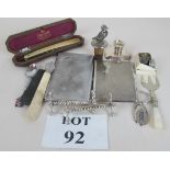 Two 1930s plated cigarette cases, a duck top bottle stopper, Mappin and Webb cased razor,