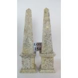 A pair of decorative marble obelisks,