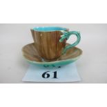 A Majolica cup and saucer est: £15-£25 (F19)