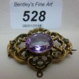A Victorian gold brooch with possible amethyst est: £140-£160