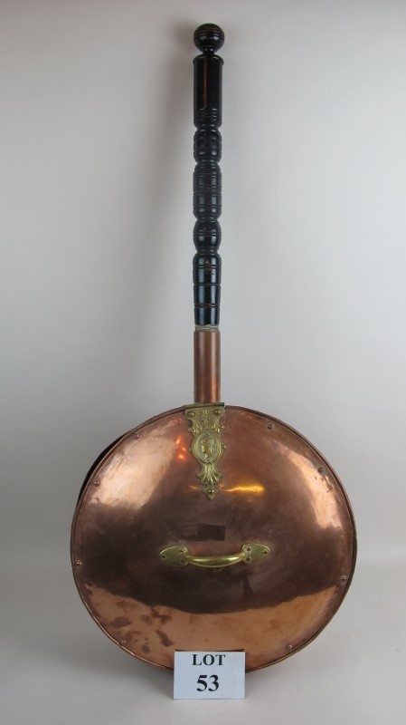 An unusually large copper warming pan with brass mounts and turned ebonised handle est: £20-£40