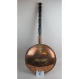 An unusually large copper warming pan with brass mounts and turned ebonised handle est: £20-£40