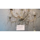 A decorative period style glass chandelier,