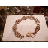 A 9ct gold gate link bracelet with padlock clasp est: £300-£400