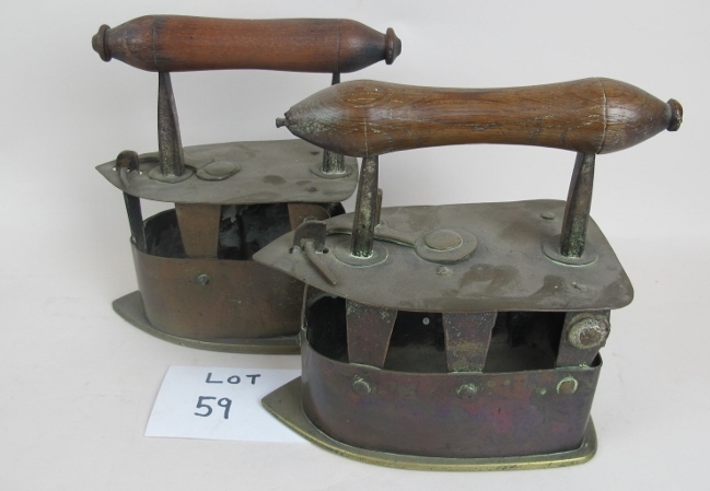Two 19th century brass and iron flat irons with fruit-wood handles,