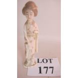 A Japanese signed carved ivory okimono depicting a Geisha, early 20th century,