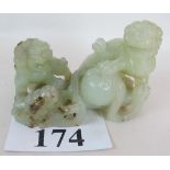 A Chinese carved jade group, 20th century, depicting two temple dogs (Shi Shi),