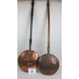 Two Victorian copper warming pans, both pierced, one with engraved decoration,
