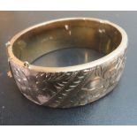 A silver gilt engraved bangle,