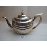 A Georgian Irish sterling silver teapot with engraved decoration,