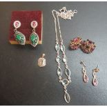 A kunzite and diamond pendant, a topaz necklace,