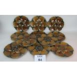 A set of eleven French Majolica oyster dishes,