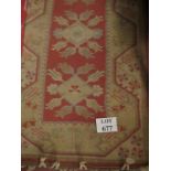 A 20c cream ground runner with pink and blue motif est: £10-£20