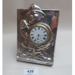 A novelty silver faced clock of a policeman pointing to the time, oak back and key,