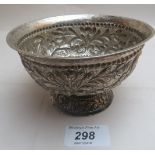 A heavily embossed pedestal dish decorated with angels,