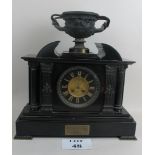 An ornate Victorian marble and bronzed metal cased chiming mantel clock of Romanesque architectural