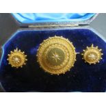 A fine 19th century engraved brooch and earrings inset with seed pearls boxed est: £300-£400