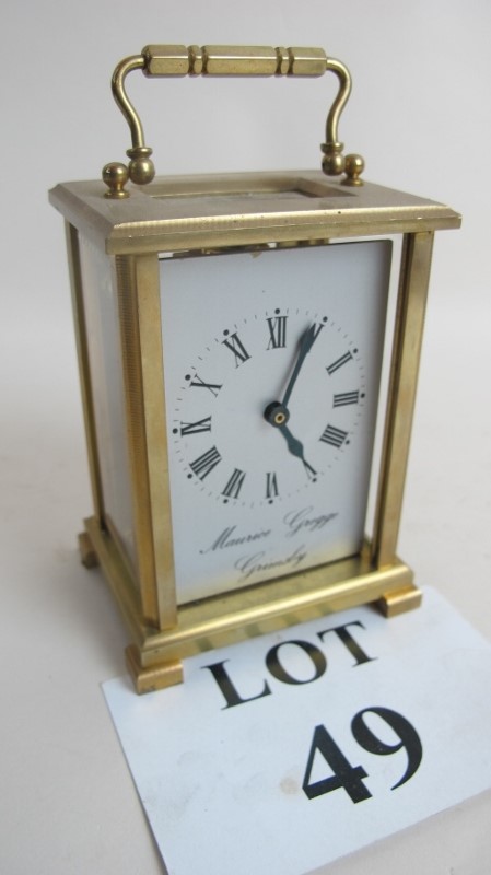 A 20th century brass cased carriage clock, inscribed 'Maurice Gregg,