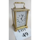 A 20th century brass cased carriage clock, inscribed 'Maurice Gregg,