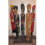 Five decorative poly-chrome wooden models of Indian colonial soldiers, modern,