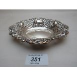 A silver oval bon bon dish with pierced and embossed flower decoration,
