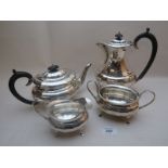 A four piece silver tea service comprising of tea pot, hot water jug,