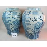 A pair of large Chinese porcelain vases in the Kangxi taste, but later,