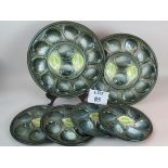 Six matching French St Clement Majolica oyster dishes,