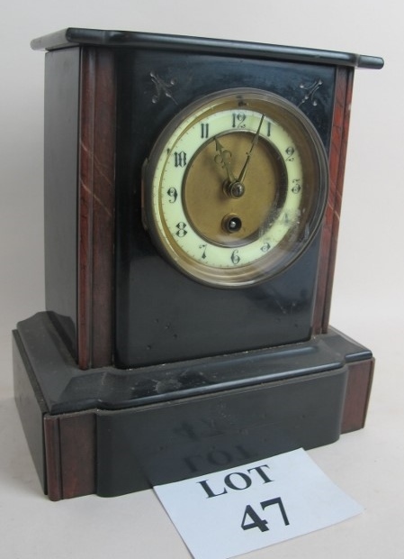 A Victorian black slate and rouge marble cased mantel clock, incised decoration,