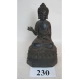 A Chinese bronze statue of a seated Buddha, Ming style probably later, seal mark to reverse,
