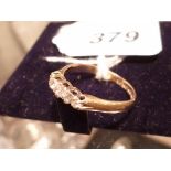 An 18ct gold five diamond set ring (size P) est: £130-£180