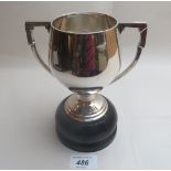 A two handled silver trophy on wooden base (approx 8oz) London 1934 est: £50-£70