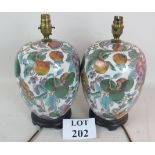 A pair of modern enamelled ceramic table lamps in the Chinese taste, wooden bases,