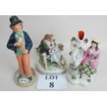 An early 20th century German porcelain figure group, hand painted and gilt decoration,