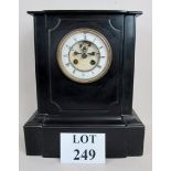 A 19th century French black slated cased mantel clock, with insight anchor escapement,