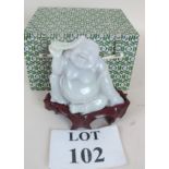 A white jade Buddha on fitted stand and with fabric covered case, approx. 10cms high ex.