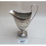 A silver helmet shaped cream jug with engraved decoration Birmingham 1893 (approx 2.