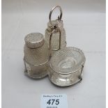 A Victorian cut glass and silver condiment set,