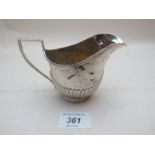 A silver cream jug with 1/2 fluting decoration Chester 1908 est: £40-£60